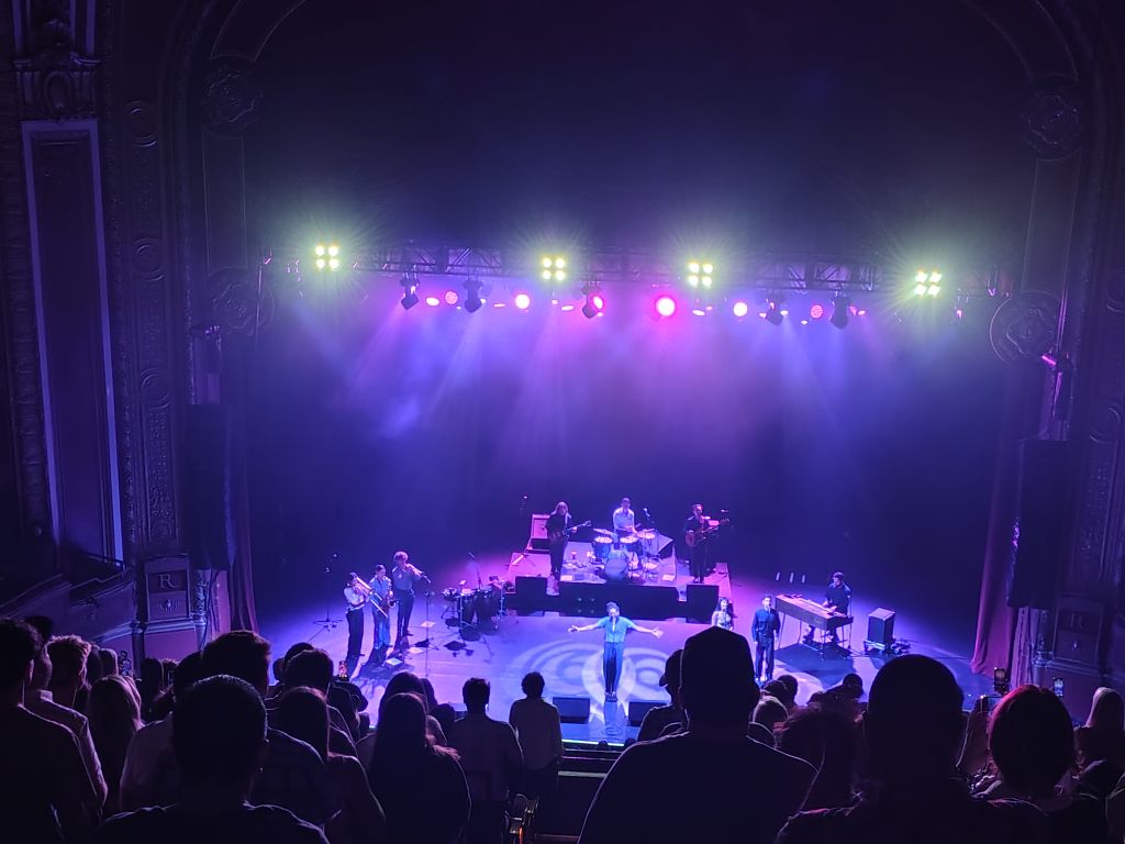A stage with Thee Sacred Souls band performing